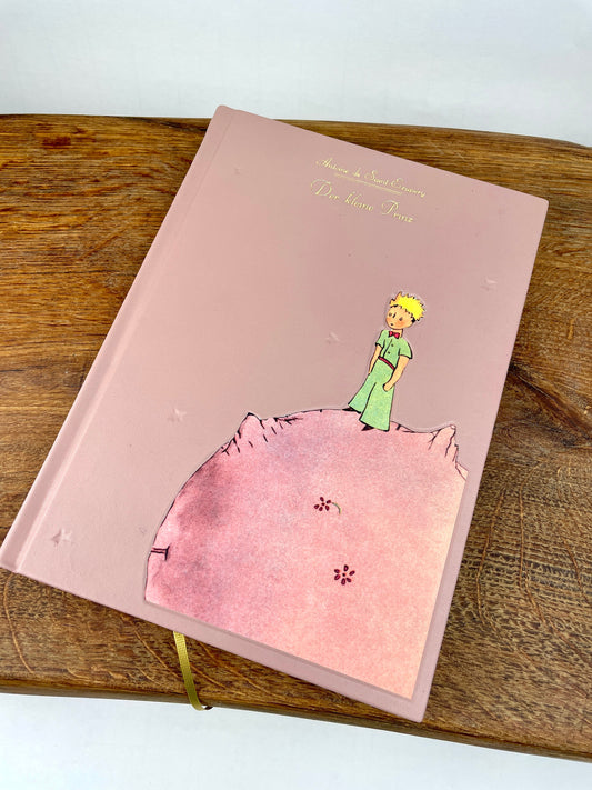 Handgebundenes „Der kleine Prinz“ Buch in altrosa Leder mit Relief und Goldprägung